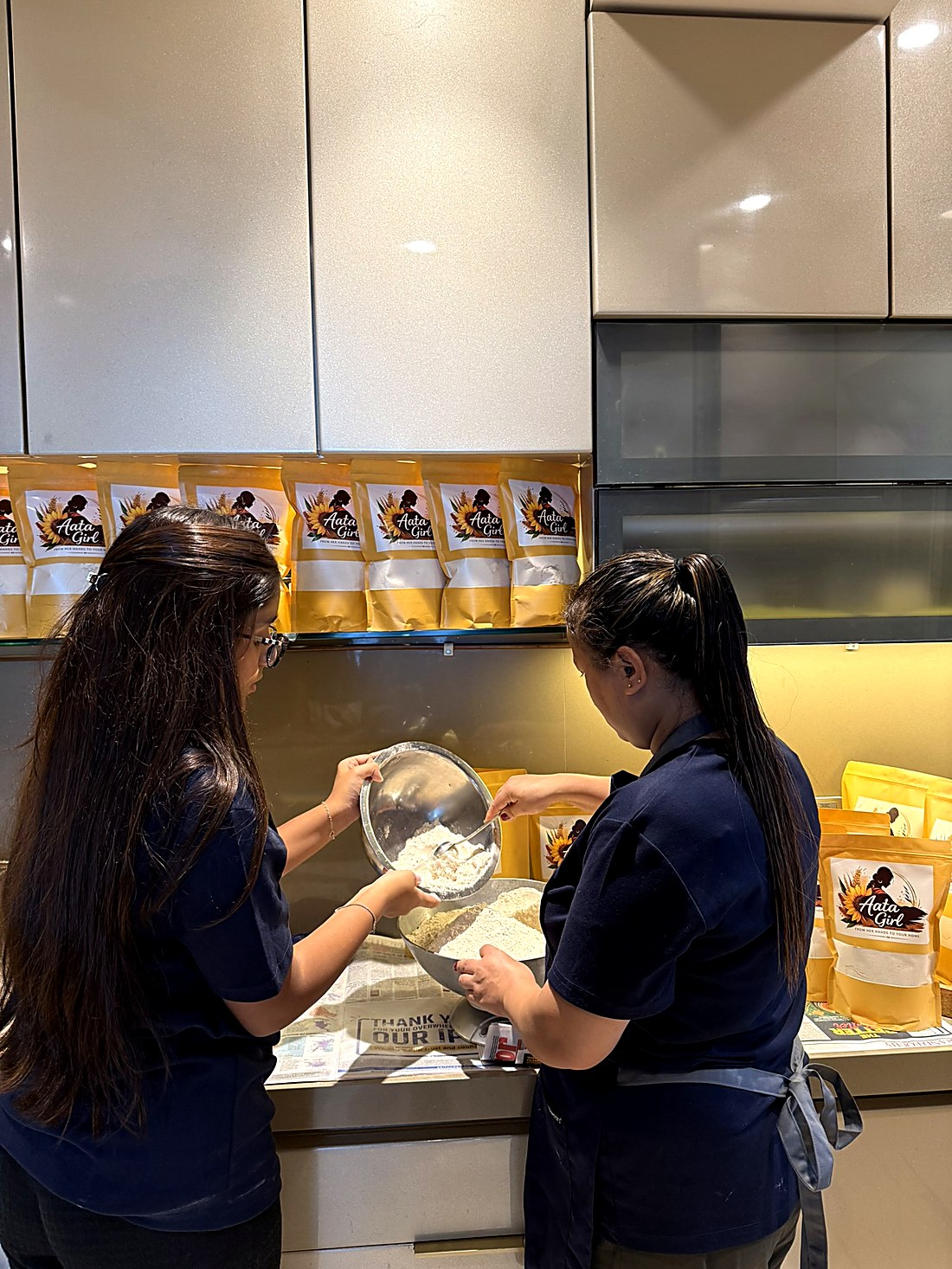 Pouring freshly milled flour into a bowl